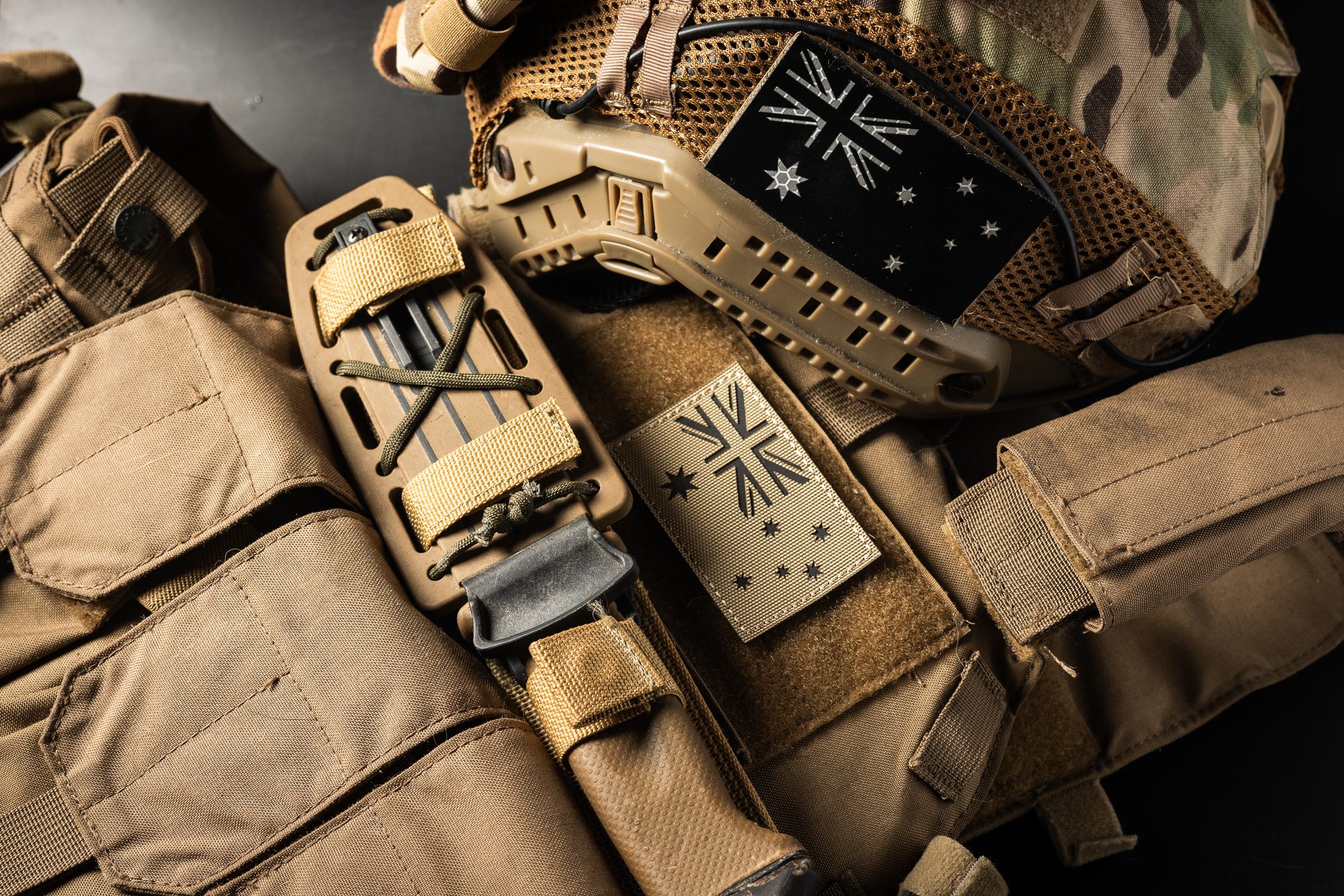 Tan tactical gear with Australian flag patches